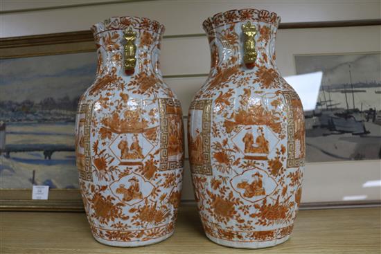 A pair of Chinese iron red and gilt porcelain vases, 19th century mounted as lamps